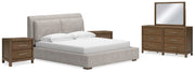 Ashley Furniture Cabalynn bedroom set with a bed, nightstands, and dresser in a modern design, shown in a cozy bedroom setting.