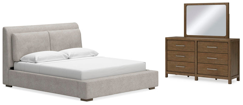 Ashley Furniture Cabalynn bedroom set featuring a bed frame, matching nightstands, and dresser in a modern design.