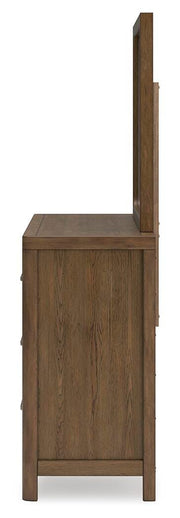 Ashley Furniture Cabalynn dresser and mirror set with a sleek wood finish and modern design, shown from a side angle.