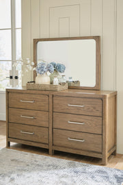 Ashley Furniture Cabalynn dresser and mirror set with wooden finish, featuring spacious drawers and a matching mirror for bedroom decor.
