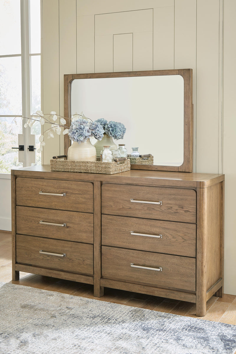 Ashley Furniture Cabalynn dresser and mirror set with wooden finish, featuring spacious drawers and a matching mirror for bedroom decor.