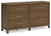 Ashley Furniture Cabalynn Dresser with multiple drawers, shown from an angled view highlighting its dark wood finish and modern design.