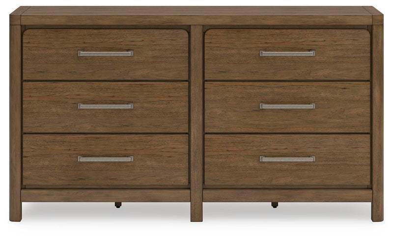Cabalynn dresser by Ashley Furniture featuring a sleek wood finish and modern design with multiple drawers for ample storage.