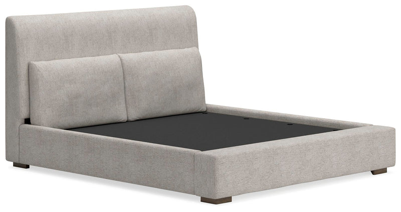 Ashley Furniture Cabalynn upholstered bed with a plush headboard and elegant design, shown from an angled view.