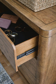Ashley Furniture Cabalynn Dresser with sleek wood finish and multiple drawers for stylish bedroom storage.
