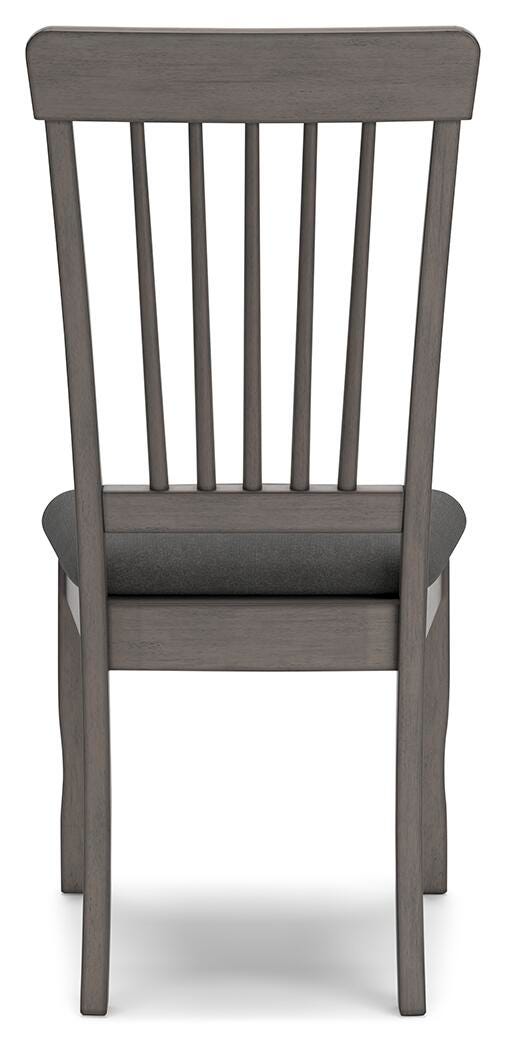 Ashley Furniture Shullden dining room set with a wooden table and matching chairs, shown from the back view.