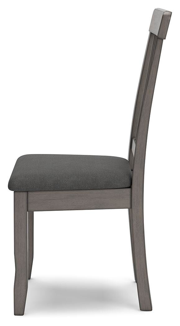 Ashley Furniture Shullden dining room set with a wooden table and matching chairs, shown from a side angle in a modern dining space.