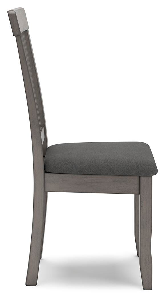 Ashley Furniture Shullden dining room set with a wooden table and matching chairs, shown from a side angle.