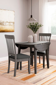 Ashley Furniture Shullden dining room set with a table and six upholstered chairs in a modern design.