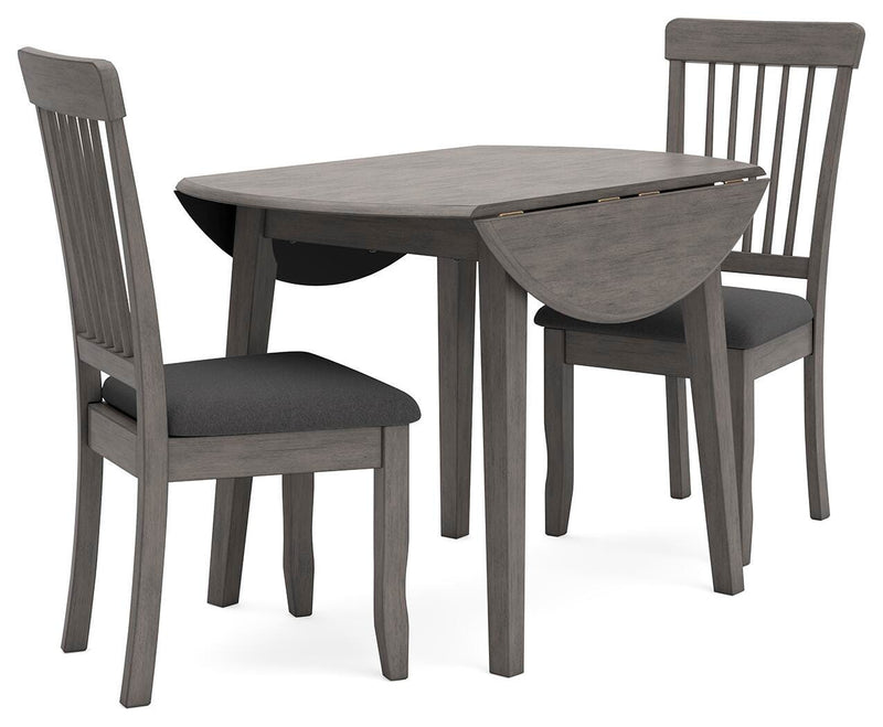 Ashley Furniture Shullden dining room set with a wooden table and six matching chairs in a modern design.