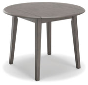 Ashley Furniture Shullden dining room set with a table and matching chairs, viewed from an angle in a modern dining space.