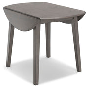 Ashley Furniture Shullden dining room set with a wooden table and matching chairs in a modern dining space.