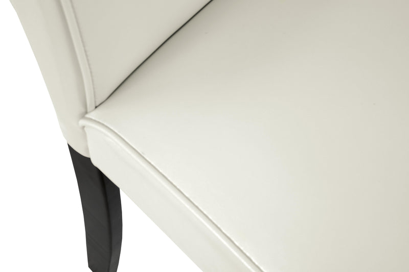 Ashley Furniture Kimonte dining chair with dark wood finish and upholstered seat, shown from a detail shot.