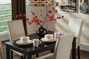 Ashley Furniture Kimonte dining chair with wooden legs and beige upholstered seat, shown from a side angle.