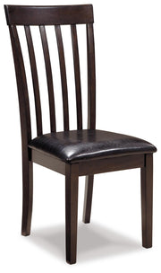 Ashley Furniture Hammis dining chair set with dark wood finish and upholstered seats, shown in a modern dining room setting.
