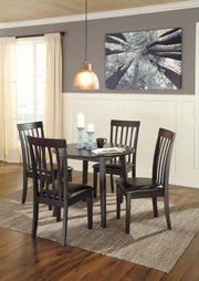 Ashley Furniture Hammis dining set with a wooden table and six matching chairs in a modern dining room setting