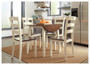 Ashley Furniture Woodanville dining room set with wooden table and six chairs, showcasing a classic dining area scene.
