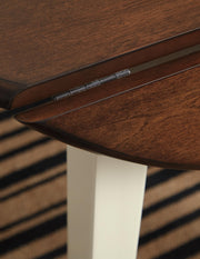 Ashley Furniture Woodanville dining room set with a wooden table and matching chairs, detailed view of the dining furniture.
