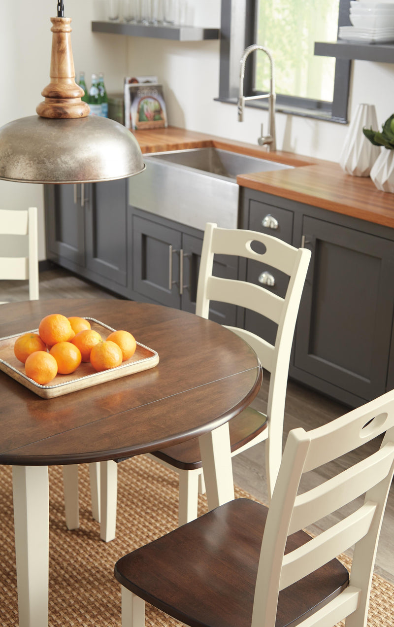 Ashley Furniture Woodanville dining room set with a wooden table and matching chairs, ideal for a contemporary dining space.