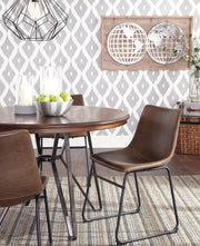 Ashley Furniture Centiar dining chair with a sleek wood frame and upholstered seat, shown in a modern dining room setting.