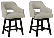 Ashley Furniture Tallenger barstool set with tall wooden legs and cushioned seats, ideal for modern kitchen or bar area.