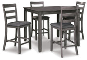 Ashley Furniture Bridson counter height dining table with four matching bar stools, shown from an angled side view.