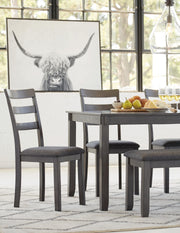 Ashley Furniture Bridson dining table with matching chairs and bench, showcasing a modern wooden dining set.
