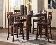 Ashley Furniture Bennox counter height dining table with four matching bar stools, featuring a dark wood finish and modern design.