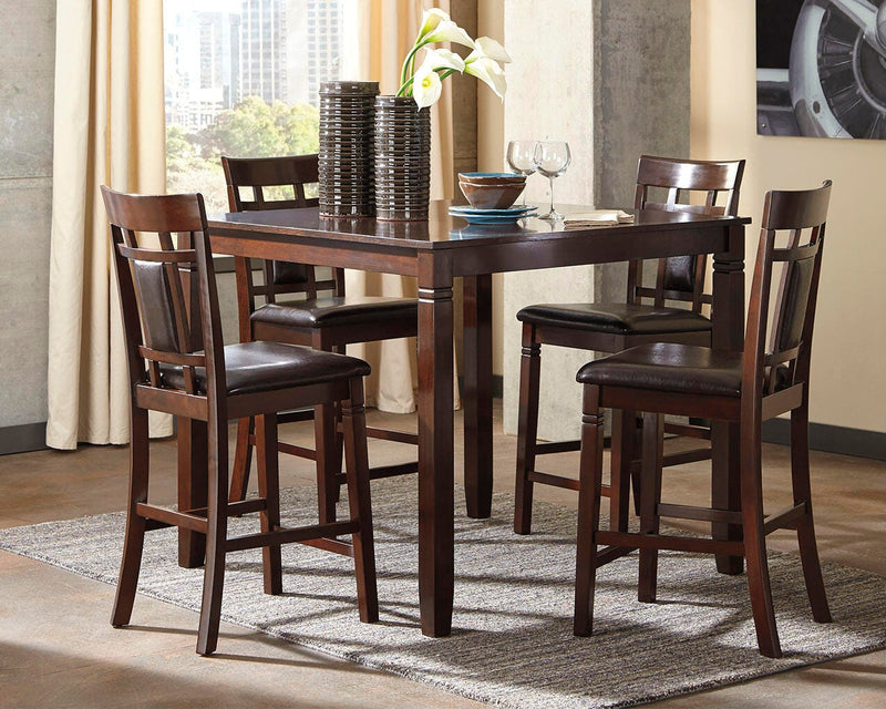 Ashley Furniture Bennox counter height dining table with four matching bar stools, featuring a dark wood finish and modern design.