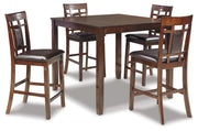 Ashley Furniture Bennox counter height dining table with four matching bar stools, showcasing a modern wood finish and sturdy design.
