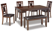 Ashley Furniture Bennox dining table with matching chairs and bench set, showcasing a stylish wood dining room furniture set.