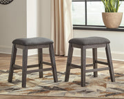 Set of Ashley Furniture Caitbrook counter height barstools with wooden seats and metal frame, ideal for dining or kitchen counters.