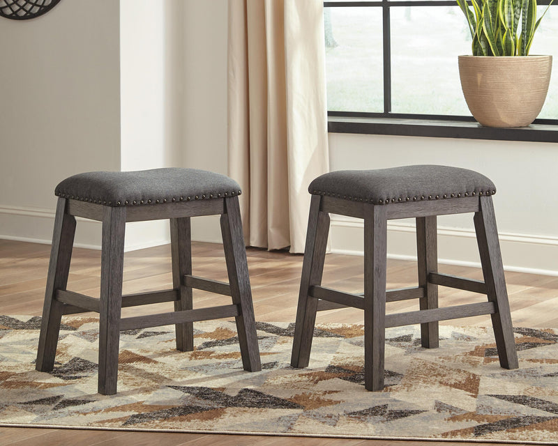 Set of Ashley Furniture Caitbrook counter height barstools with wooden seats and metal frame, ideal for dining or kitchen counters.