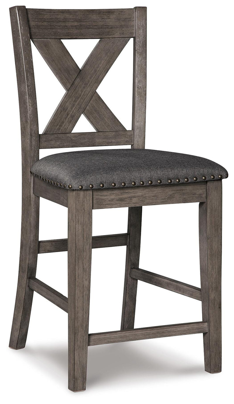 Ashley Furniture Caitbrook counter height upholstered bar stool with padded seat and wooden legs, ideal for kitchen or bar area.