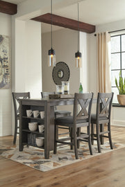 Ashley Furniture Caitbrook counter height upholstered bar stool with padded seat and wooden legs, shown in a modern dining setting.