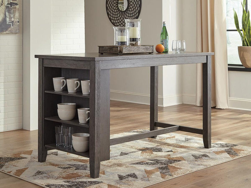 Set of four Ashley Furniture Caitbrook counter height barstools with wooden legs and upholstered seats, arranged around a dining table.