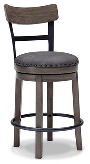 Ashley Furniture Caitbrook counter height bar stool with wooden legs and a cushioned seat, shown from an angled side view.