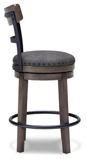 Ashley Furniture Caitbrook counter height bar stool shown from the side with wooden legs and cushioned seat.