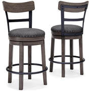 Ashley Furniture Caitbrook counter height bar stool with wooden legs and cushioned seat, shown from a side angle.
