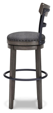 Ashley Furniture Caitbrook bar height bar stool with wooden legs and cushioned seat, shown from a side angle.