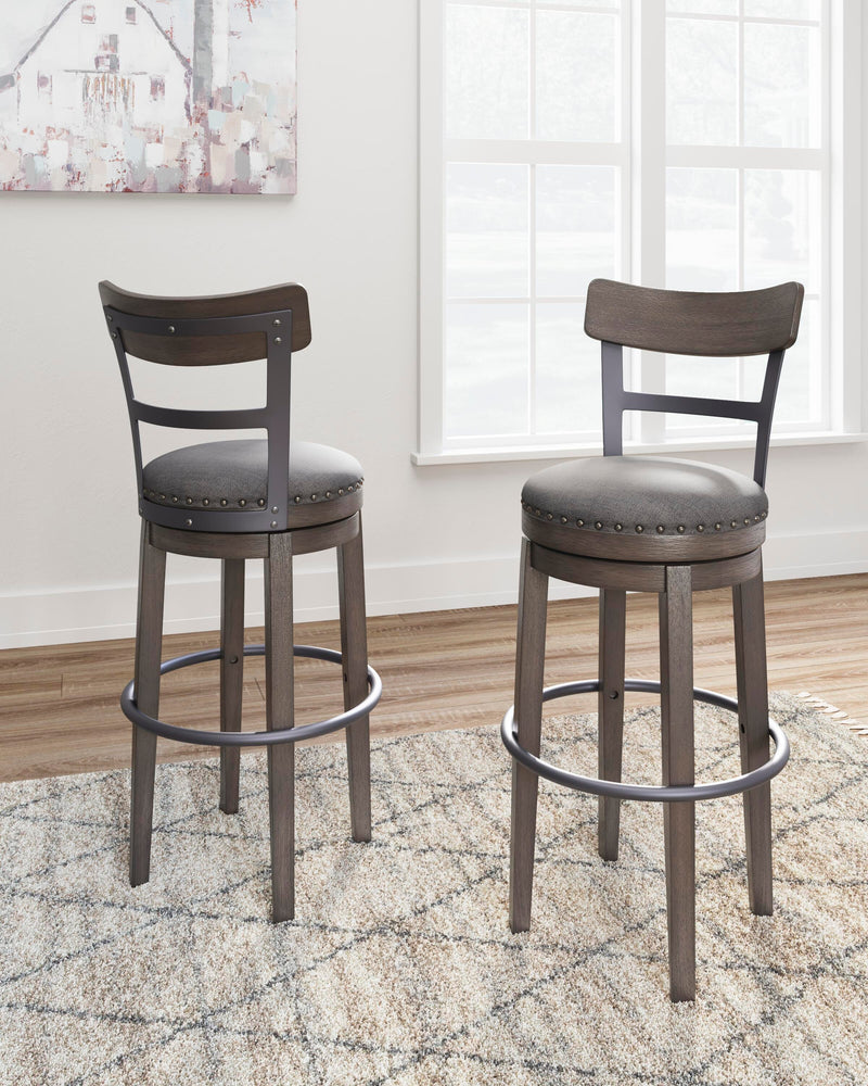 Ashley Furniture Caitbrook bar height bar stool with a wooden seat and metal frame, showing a modern design for home bar seating.