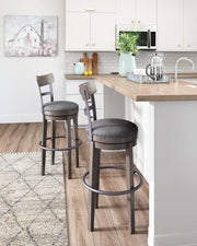 Ashley Furniture Caitbrook bar height bar stool with wooden legs and cushioned seat, ideal for kitchen or bar area.