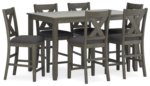 Ashley Furniture Caitbrook counter height dining table with six matching bar stools, shown from an angled side view.
