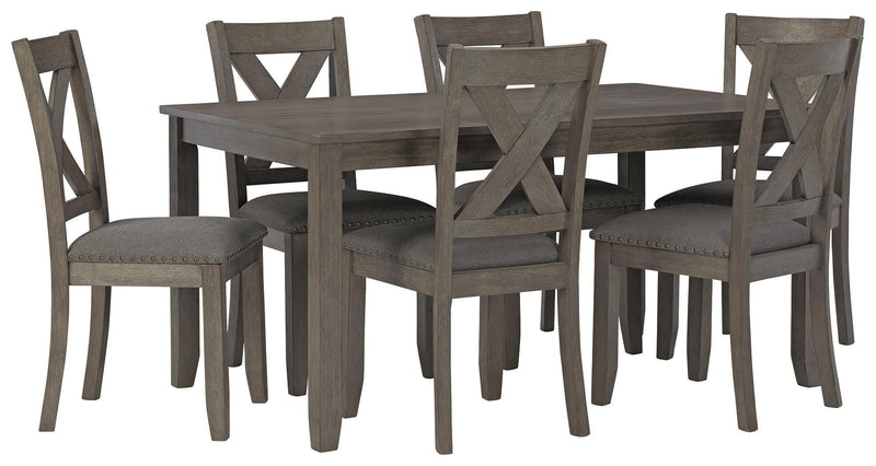 Ashley Furniture Caitbrook dining table with six matching chairs, featuring a classic wooden design and angled view.