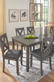 Ashley Furniture Caitbrook dining table with six matching chairs, showcasing a wood finish and classic design for a dining room.