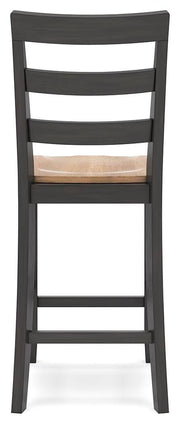 Ashley Furniture Gesthaven counter height barstool with a wooden seat and backrest, metal frame, and modern design.