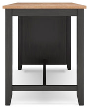 Ashley Furniture Gesthaven counter height dining table with a wooden finish and sturdy legs, shown from a side angle.