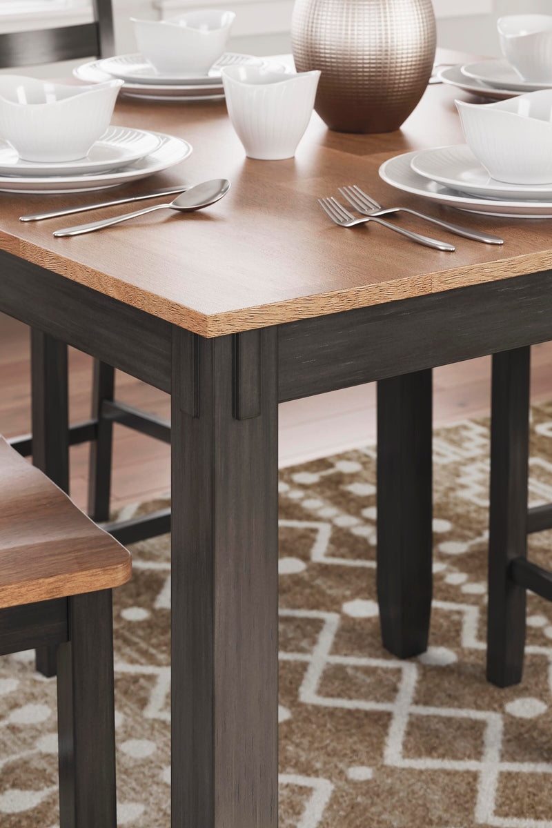Ashley Furniture Gesthaven counter height dining table with four matching barstools, featuring a wooden finish and modern design details.