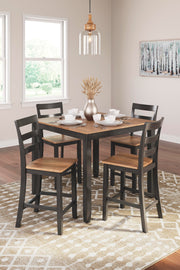 Ashley Furniture counter height dining table with four matching barstools, showcasing a modern wood finish and clean design.