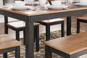 Ashley Furniture Gesthaven dining table with four chairs and a bench, showcasing a stylish wood finish and modern design.